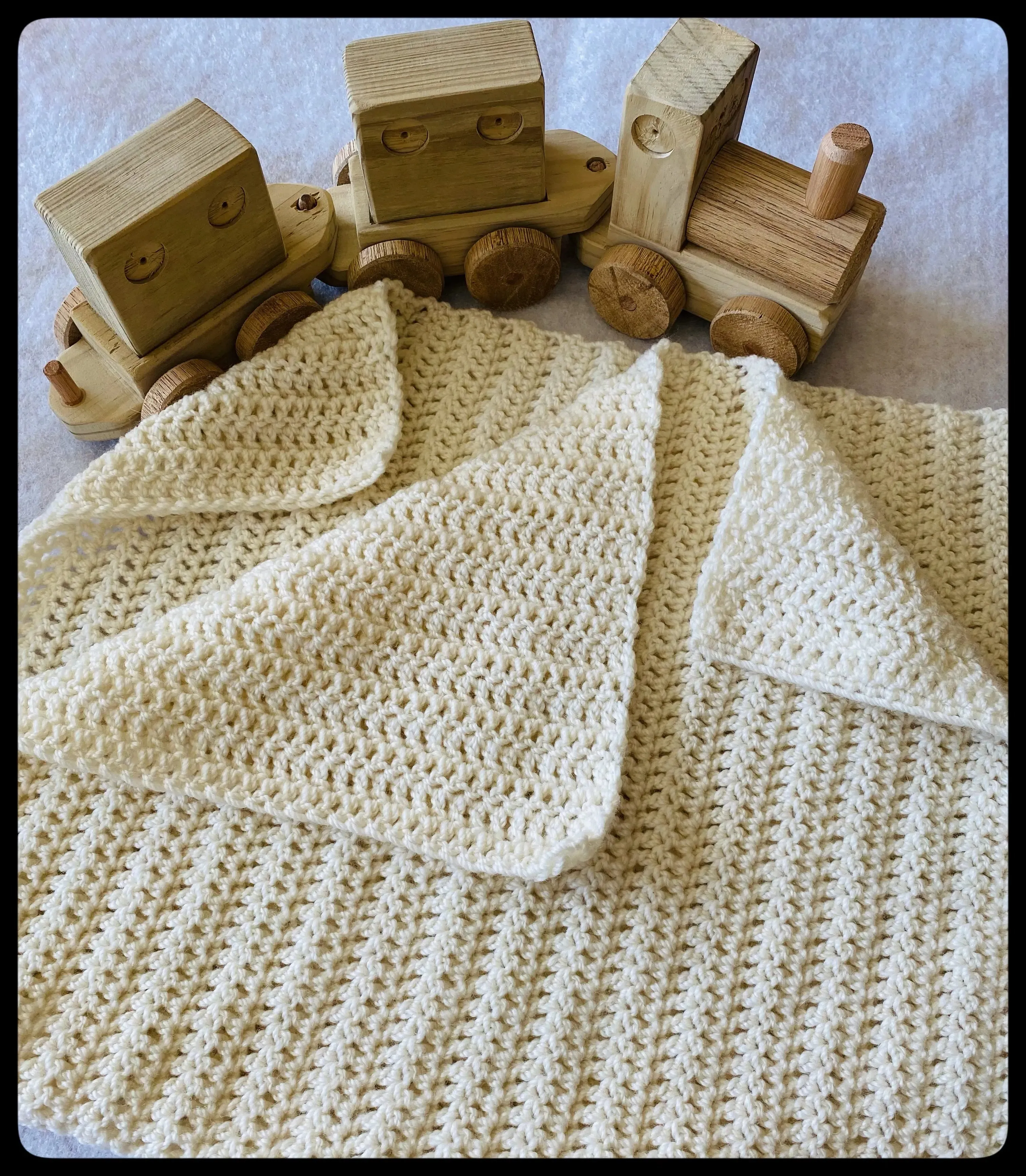 "Eyelet" wool baby blanket